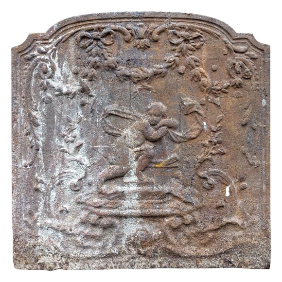 Fireback from the 19th century in the Louis XV style with the  Fireback from the 19th century in the Louis XV style with the