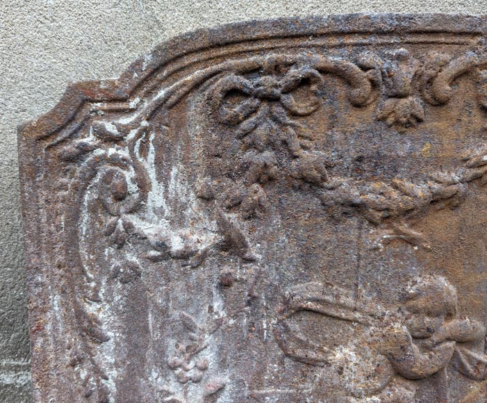 Fireback from the 19th century in the Louis XV style with the  Fireback from the 19th century in the Louis XV style with the