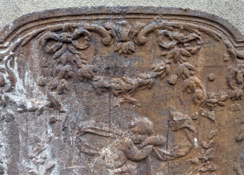 Fireback from the 19th century in the Louis XV style with the  Fireback from the 19th century in the Louis XV style with the