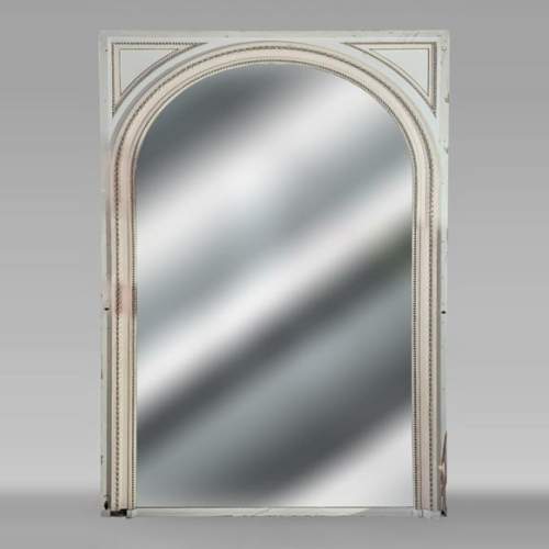 Louis XVI style trumeau with rounded top decorated with pearl friezes