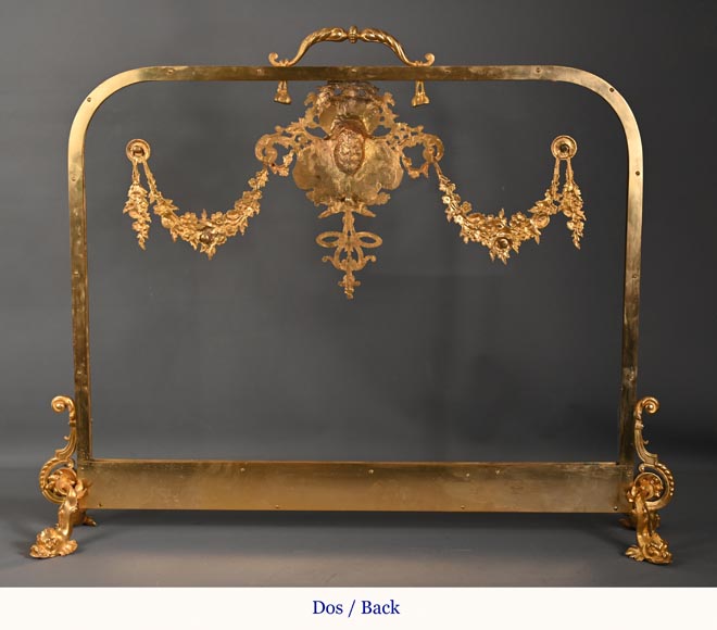 Napoleon III style fireback with woman's mask and garland of flowers in gilded bronze and glass. Napoleon III style fireback with woman's mask and garland of flowers in gilded bronze and glass.-10