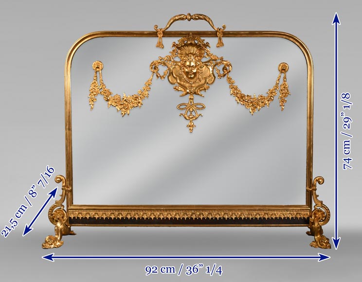 Napoleon III style fireback with woman's mask and garland of flowers in gilded bronze and glass. Napoleon III style fireback with woman's mask and garland of flowers in gilded bronze and glass.-11