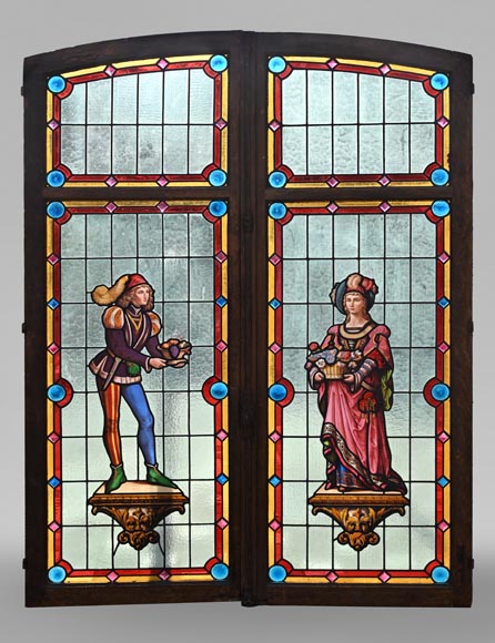 Double stained glass window in neo-Renaissance style depicting two figures with offerings Double stained glass window in neo-Renaissance style depicting two figures with offerings-0