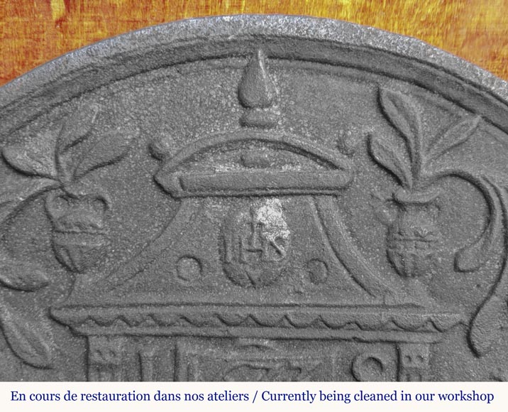 Cast iron fireback in a semicircle, dated 1623 Cast iron fireback in a semicircle, dated 1623-1