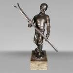 “Skier”, statuette in patinated regula