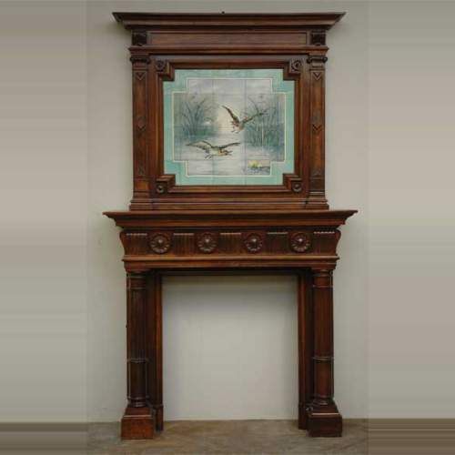 Antique walnut mantel with ceramic from the 19th century