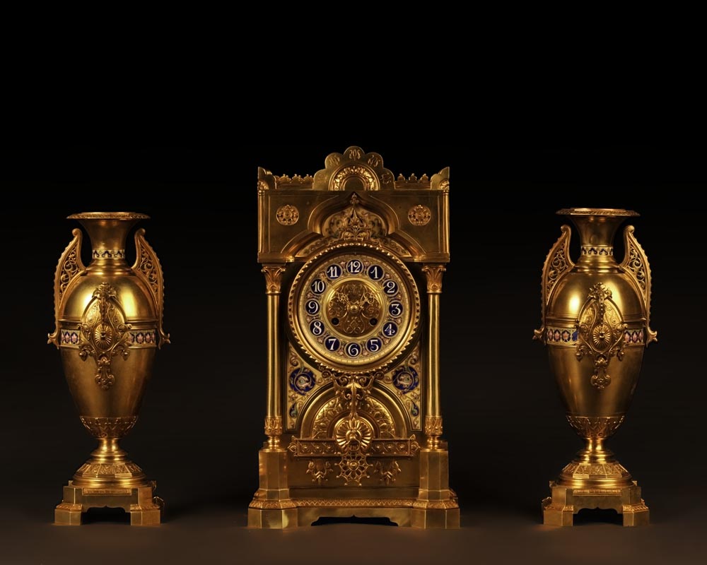 Mantle garniture in the orientalist taste  in gilt-bronze with  polychrome porcelain decoration   Mantle garniture in the orientalist taste  in gilt-bronze with  polychrome porcelain decoration  -0