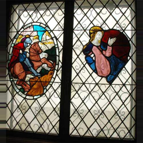 Two stained glasses elements with knight in armor