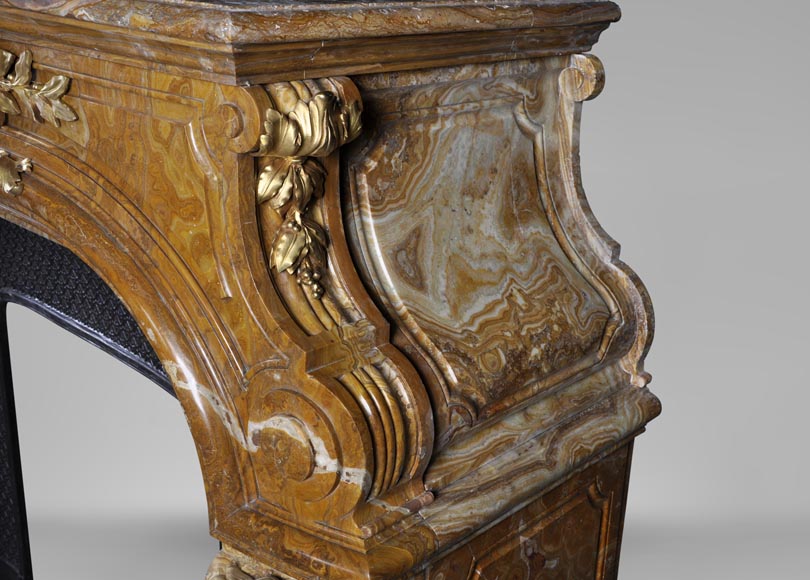 Extraordinary antique Louis XIV style fireplace with lions heads in Alabastro di Busca and gilded bronze