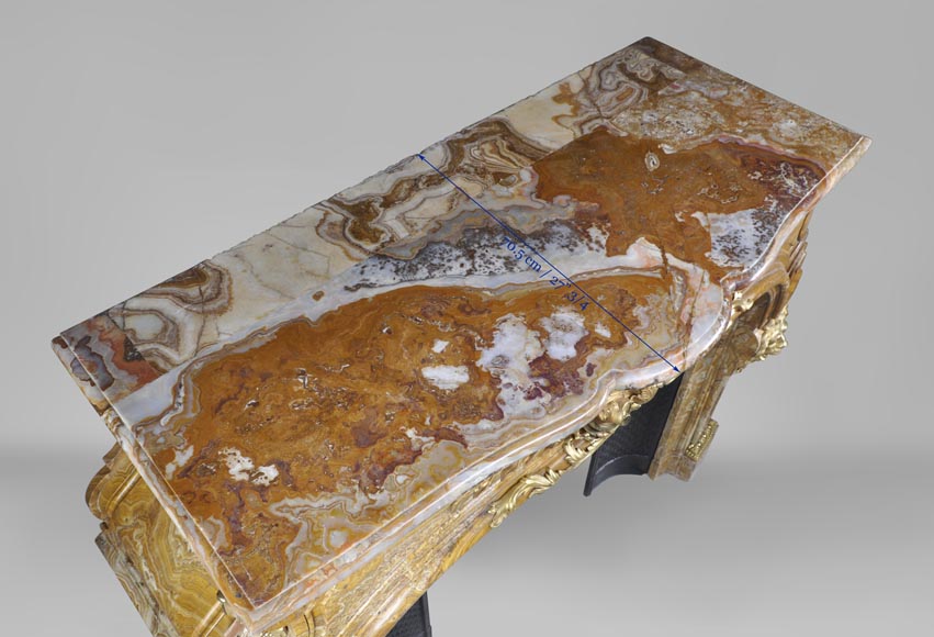 Extraordinary antique Louis XIV style fireplace with lions heads in Alabastro di Busca and gilded bronze