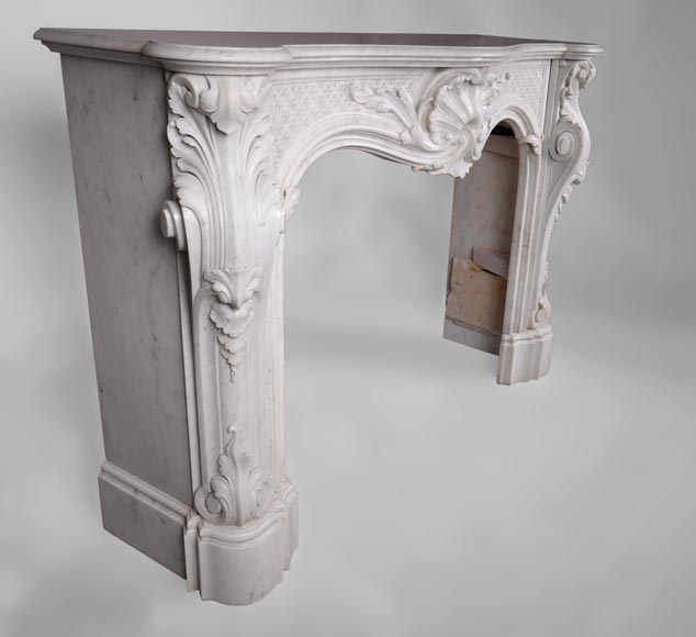 Beautiful antique Louis XV style fireplace with opulent decor in white Carrara marble Beautiful antique Louis XV style fireplace with opulent decor in white Carrara marble-2