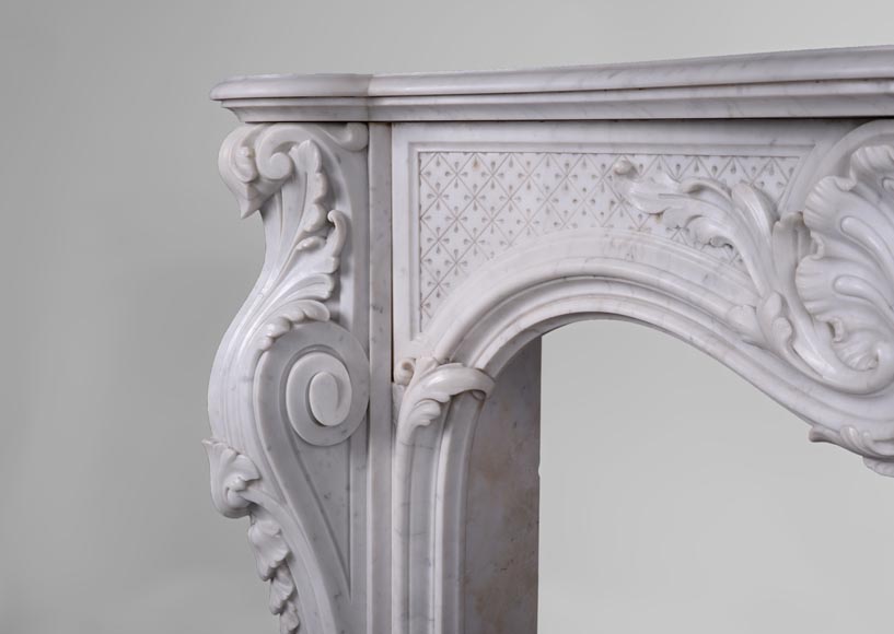 Beautiful antique Louis XV style fireplace with opulent decor in white Carrara marble Beautiful antique Louis XV style fireplace with opulent decor in white Carrara marble-3