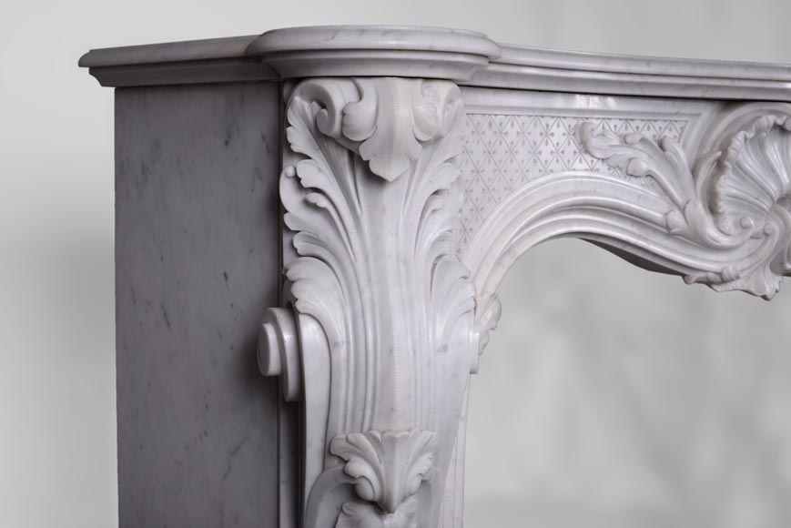 Beautiful antique Louis XV style fireplace with opulent decor in white Carrara marble Beautiful antique Louis XV style fireplace with opulent decor in white Carrara marble-4
