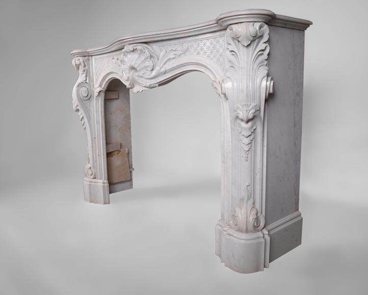 Beautiful antique Louis XV style fireplace with opulent decor in white Carrara marble Beautiful antique Louis XV style fireplace with opulent decor in white Carrara marble-7