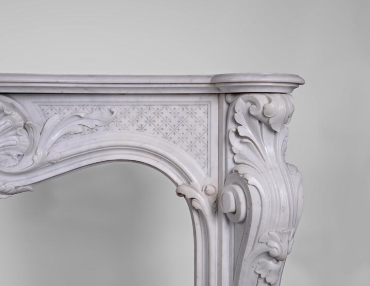 Beautiful antique Louis XV style fireplace with opulent decor in white Carrara marble Beautiful antique Louis XV style fireplace with opulent decor in white Carrara marble-8