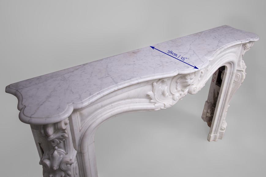 Beautiful antique Louis XV style fireplace with rich decor in white Carrara marble Beautiful antique Louis XV style fireplace with rich decor in white Carrara marble-9