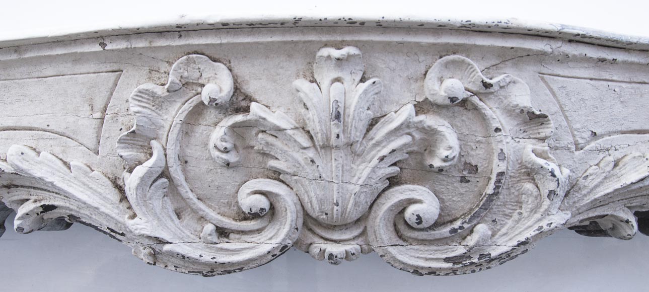 A beautiful antique richly sculpted fireplace from Louis XV period made out of painted oak A beautiful antique richly sculpted fireplace from Louis XV period made out of painted oak-1