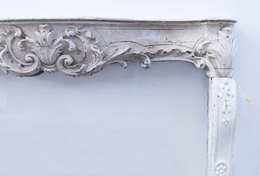 A beautiful antique richly sculpted fireplace from Louis XV period made out of painted oak A beautiful antique richly sculpted fireplace from Louis XV period made out of painted oak-8