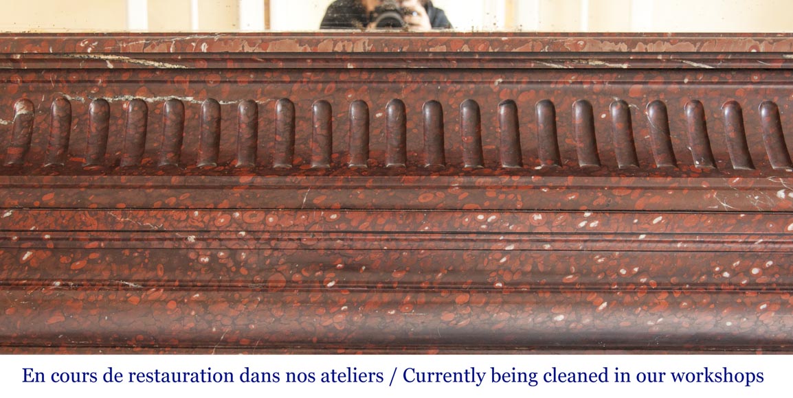 An antique Louis XIV style fireplace, with acroterion and Bollection, made out of Rouge Griotte marble An antique Louis XIV style fireplace, with acroterion and Bollection, made out of Rouge Griotte marble-1