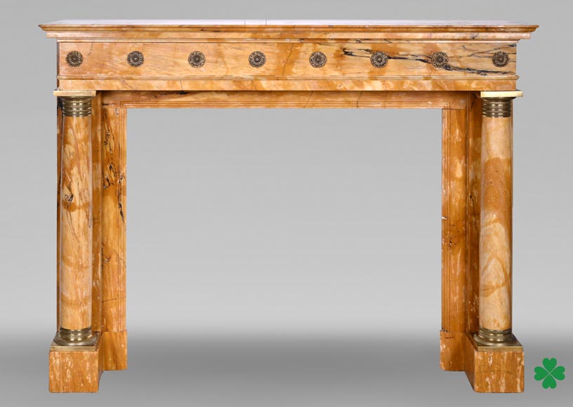 Empire style fireplace in Sienna yellow marble with columns and gilt bronze rosettes Empire style fireplace in Sienna yellow marble with columns and gilt bronze rosettes-0