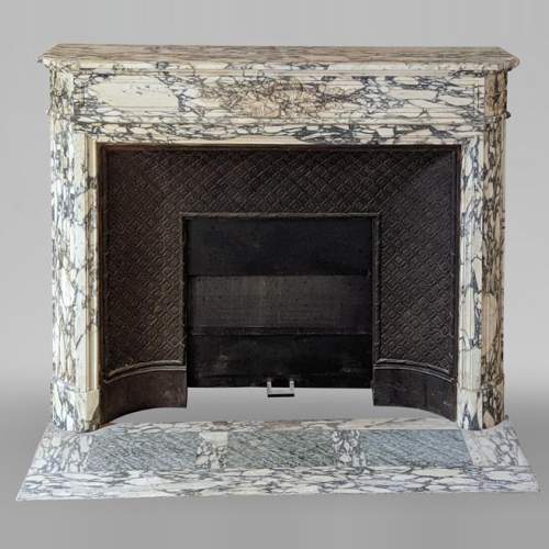 Louis XVI style mantel in Violet Breccia with a laurel crown