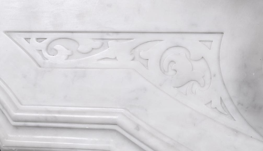 A richly sculpted Carrara marble fireplace in the Napoleon III style, decorated with a lion's head. A richly sculpted Carrara marble fireplace in the Napoleon III style, decorated with a lion's head.-3