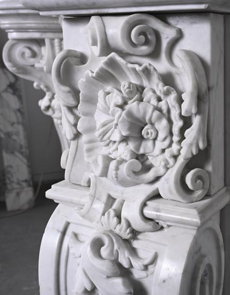 A richly sculpted Carrara marble fireplace in the Napoleon III style, decorated with a lion's head. A richly sculpted Carrara marble fireplace in the Napoleon III style, decorated with a lion's head.-10