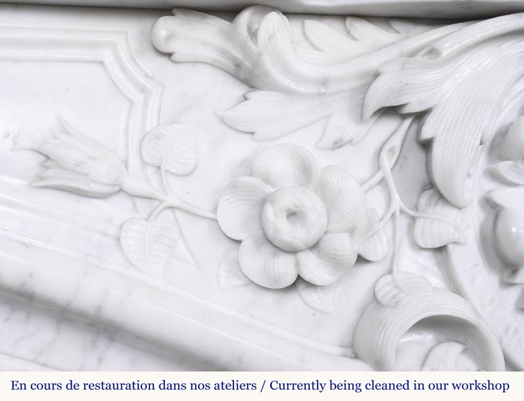 A highly sculpted Louis XV style fireplace in Carrara marble, decorated with a shell motif. A highly sculpted Louis XV style fireplace in Carrara marble, decorated with a shell motif.-4