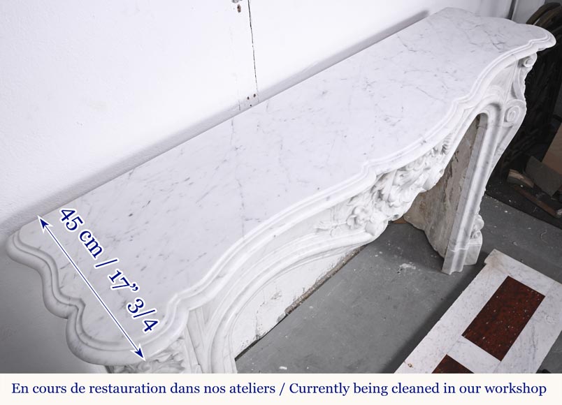 A highly sculpted Louis XV style fireplace in Carrara marble, decorated with a shell motif. A highly sculpted Louis XV style fireplace in Carrara marble, decorated with a shell motif.-15