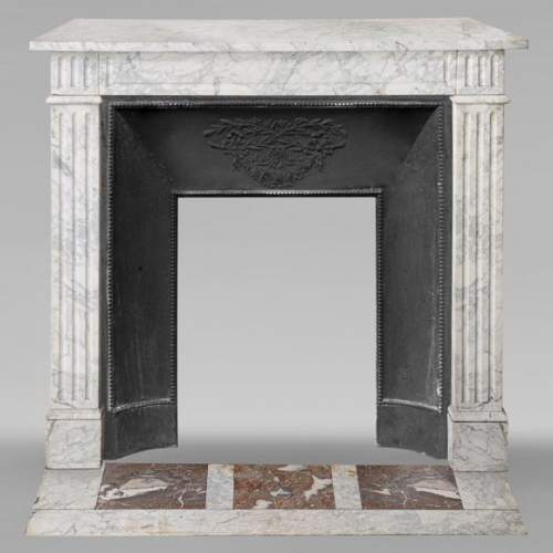 Louis XVI style mantel in veined Carrara marble with fluting