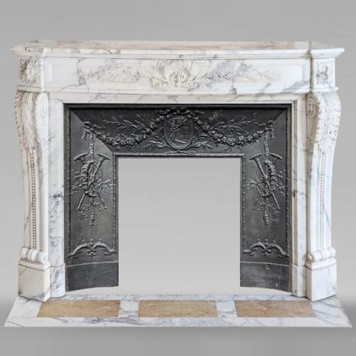 Curved Louis XVI style mantel in Arabescato marble decorated with a laurel wreath