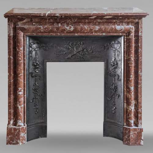 Louis XIV style mantel in Rouge du Nord marble