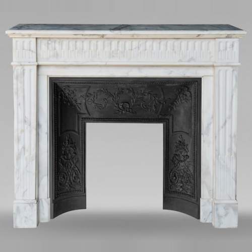 Louis XVI style mantel in semi-statuary marble decorated with curved flutes