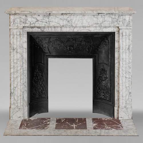 Louis XVI style molded mantel in highly veined Carrara marble