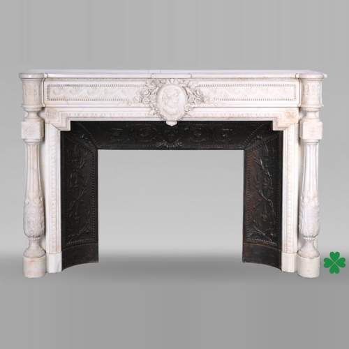 Louis XVI style white marble fireplace with columns and female profile medallion