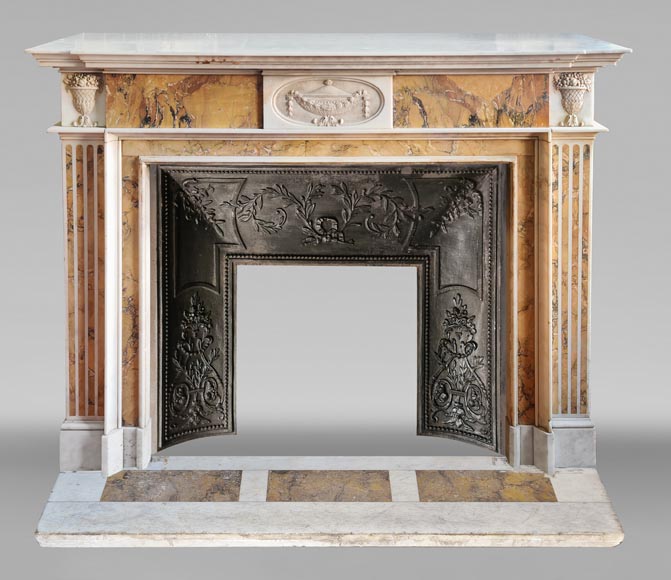 Louis XVI style two-tone fireplace in Carrara white and Sienna yellow, decorated with flower vases Louis XVI style two-tone fireplace in Carrara white and Sienna yellow, decorated with flower vases-0