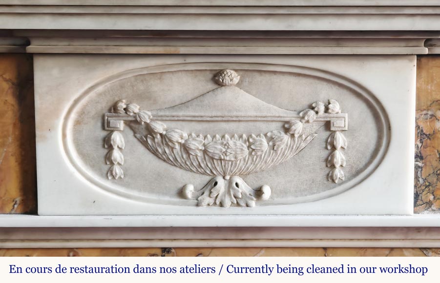 Louis XVI style two-tone fireplace in Carrara white and Sienna yellow, decorated with flower vases Louis XVI style two-tone fireplace in Carrara white and Sienna yellow, decorated with flower vases-1