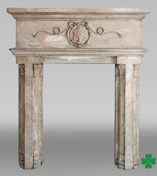 Carved stone fireplace with three-faced mask decoration Carved stone fireplace with three-faced mask decoration-0
