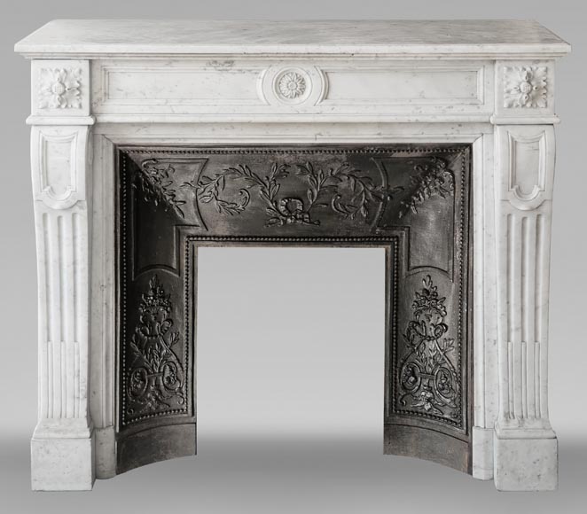 Louis XVI style fireplace in Carrara marble, decorated with a flower Louis XVI style fireplace in Carrara marble, decorated with a flower-0
