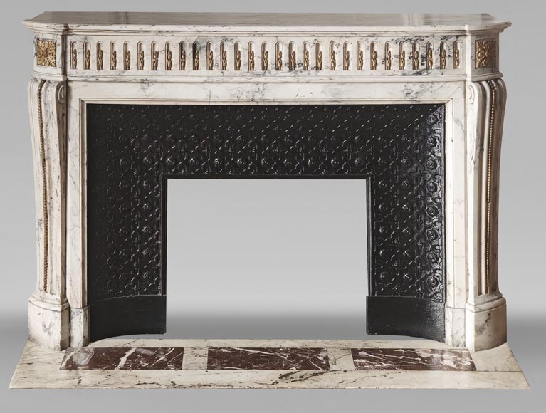 Curved Louis XVI style fireplace in veined marble, with bronze asparagus decoration Curved Louis XVI style fireplace in veined marble, with bronze asparagus decoration-0