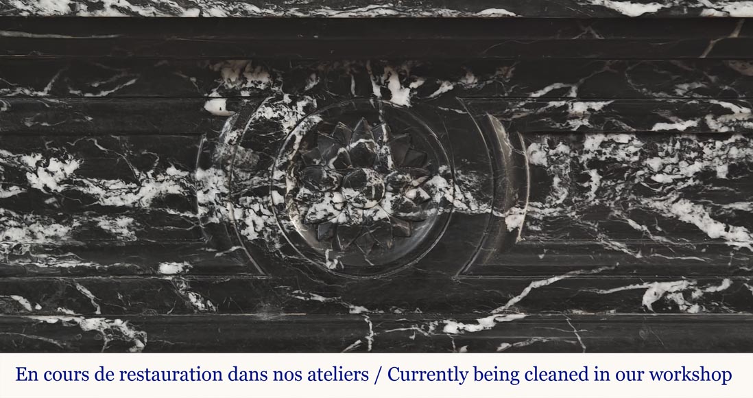 Louis XVI style fireplace decorated with a flower, in black Marquina marble Louis XVI style fireplace decorated with a flower, in black Marquina marble-1