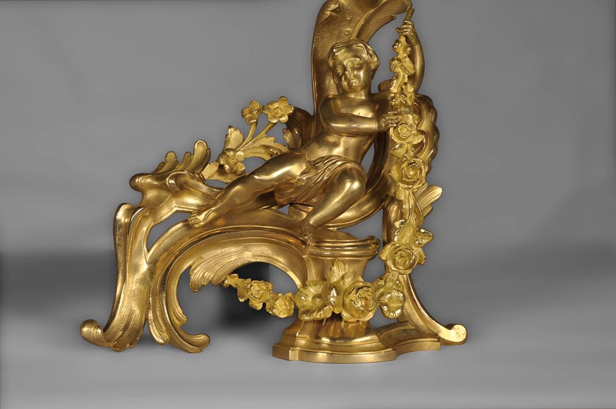 Antique Louis XV style andirons made out of gilded bronze with