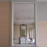 Antique Louis XVI style pier glass with frieze of foliages