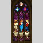 Stained glass window from a chapel with Jesus as central figure