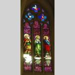 Stained glass window from a chapel with Mary as central figure