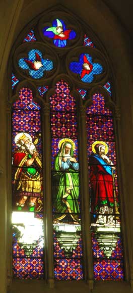 Stained glass window from a chapel with Mary as central figure-0