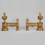 Antique pair of gilt bronze andirons, Louis XVI style, with fire pots decor