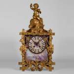 A Napoleon III style clock made out of porcelain and gilded bronze representing Bacchus, god of wine