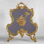 Antique Louis XV style firescreen in gilt bronze with birds and music instruments decoration