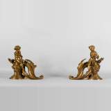 Pair of Louis XV style andirons in gilded bronze decorated with children in vineyards